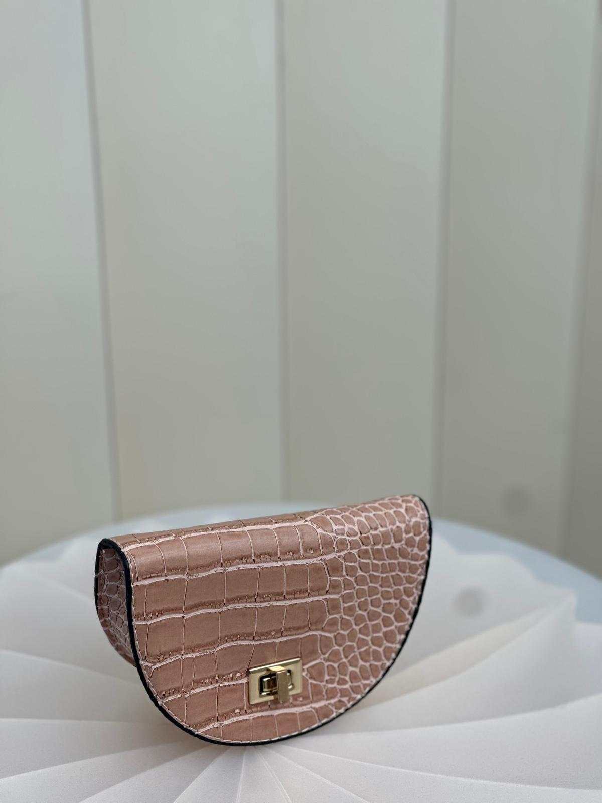 Small bag with Hebrew text meaning "The new item that will always accompany you"